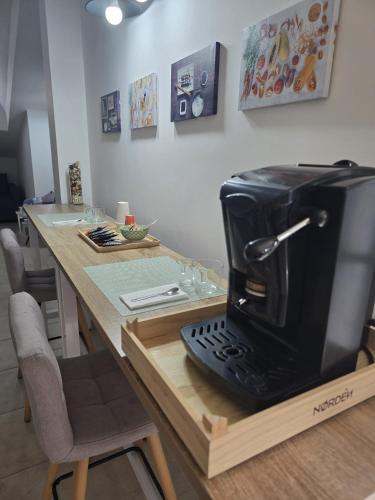 a coffee maker sitting on top of a counter at Caly Home in Caserta