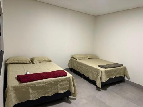 En eller flere senge i et værelse på Residência Vale do Araguaia