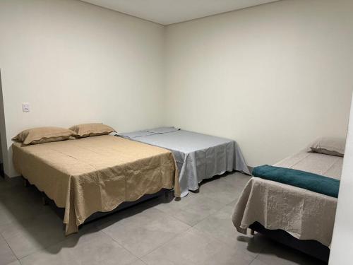 En eller flere senge i et værelse på Residência Vale do Araguaia