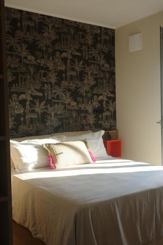 Ένα ή περισσότερα κρεβάτια σε δωμάτιο στο A la plage R