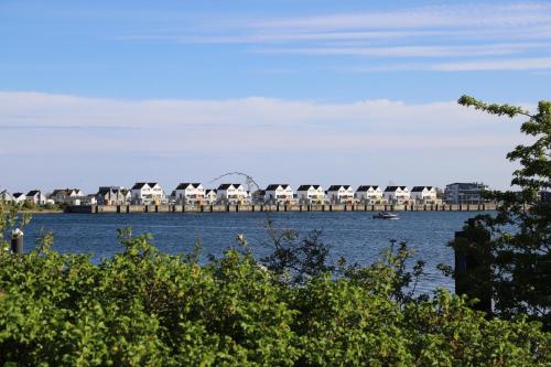 a body of water with a bridge in the background at Ferienwohnung Mövenkieker in Kappeln