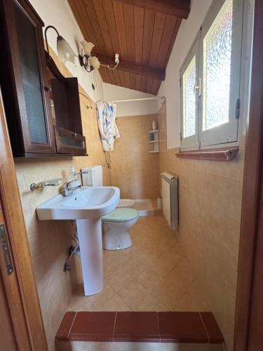 a bathroom with a sink and a toilet at Borgo Antico Satriano in Satriano