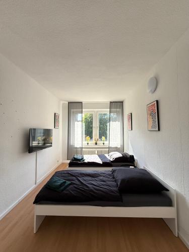 Katil atau katil-katil dalam bilik di Ruhrpott Apartment Zentral