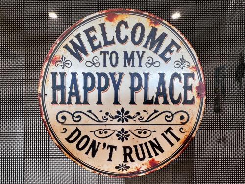 a sign that says welcome to my happy place dont run up at Cosy Room in North Ryde #2 in Sydney