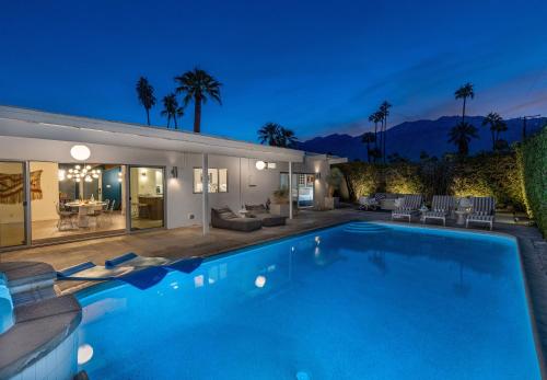 a swimming pool in the backyard of a house at Mid Century Mood House by ACME House Company in Palm Springs
