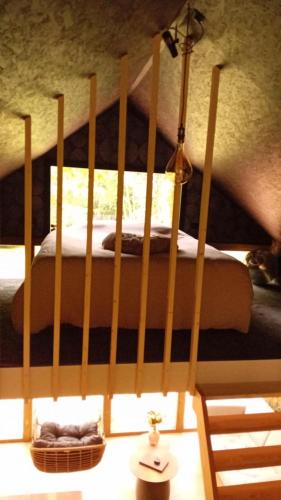 a bedroom with a bunk bed in a room at La Cabane du Gardien in Marche-en-Famenne