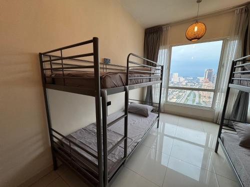 Ένα ή περισσότερα κρεβάτια σε δωμάτιο στο HaBiBi hOmE Klcc