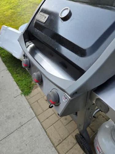 a toilet sitting on the side of a sidewalk at Spacious Lakefront Home with Firepit Near South Haven in Grand Junction