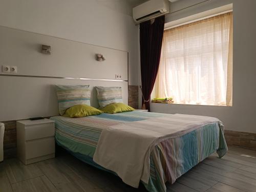 Ένα ή περισσότερα κρεβάτια σε δωμάτιο στο Apartamentos Bcntourism