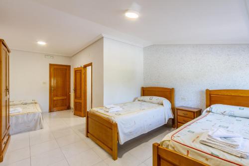 Postel nebo postele na pokoji v ubytování Hostal Sequeiros