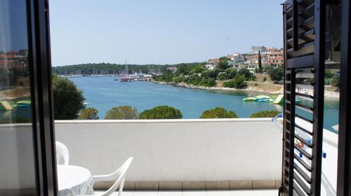 a view of a river from a balcony at Suran Apartments in Pula