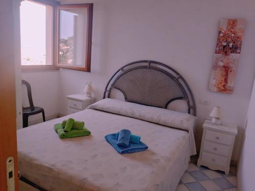 Katil atau katil-katil dalam bilik di Mare, dune, lago e bosco in assoluto relax.