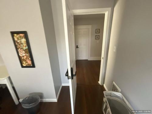 a hallway with a door leading into a room at Cozy private room - 11 mins to Downtown & Airport in Birds Nest