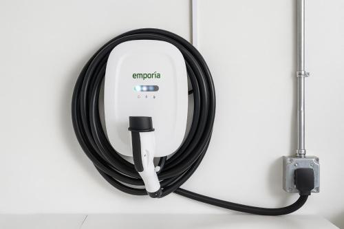 a black coaxial cable hanging on a wall at Entire Home 3BR Hidden Gem Getaway with Level 2 EV Charger, Central Location in McKinney