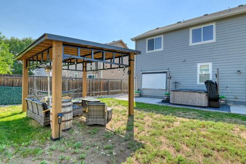 a gazebo in a yard in front of a house at FlightDeck HotTub Fireplace NearAirport FamilyHome in Colorado Springs