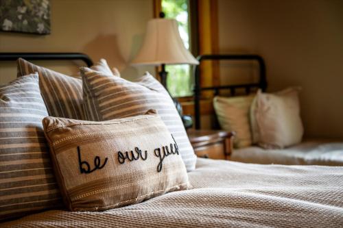 a bed with a pillow with the words be super good at Sky View - Luxury Mountain Golf Home in Whittier