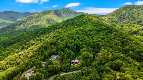 an aerial view of a house in the mountains at Sky View - Luxury Mountain Golf Home in Whittier