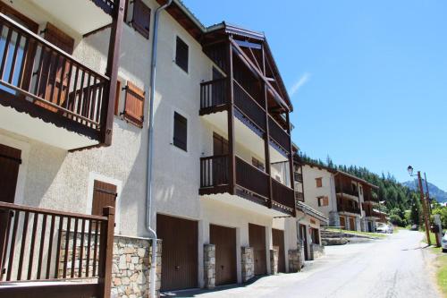 a building with balconies on the side of a street at Résidence Belvedere Busseroles - RESIDENCE LE BELVEDERE "BUSSEROLES" - BELVB12 MAE-3102 in Modane
