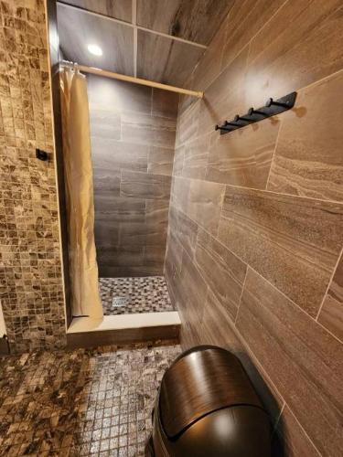 a bathroom with a toilet and a shower at Sky Nest Glamp-Unplug-Reconnect in Red Bay