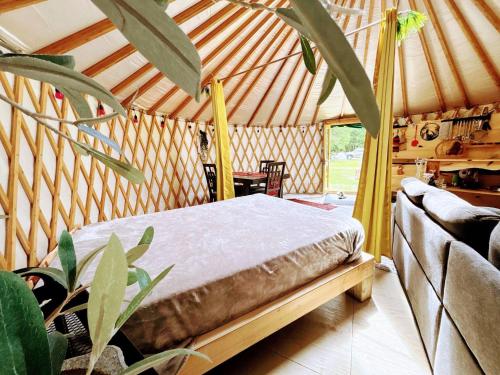 a bedroom with a bed in a yurt at Star-Lake Yurt Sanctuary Waterview in Red Bay