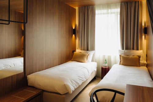 Postel nebo postele na pokoji v ubytování Door9 Hasselt - Digital Hotel