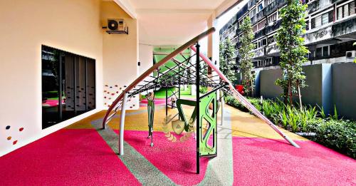 a staircase in a building with a pink carpet at Kuala Lumpur Luxury Suites By Majestic Residence in Kuala Lumpur