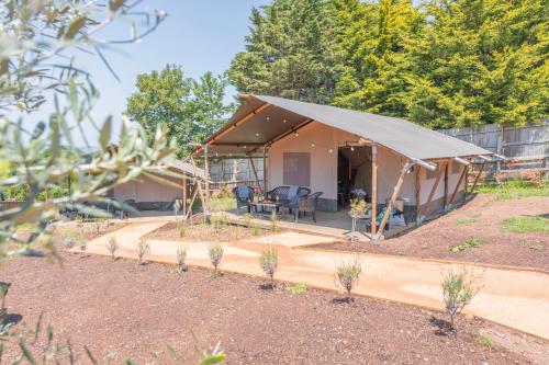 a tent is set up in a garden at Luxury Glamping at Stags Head in Abbotskerswell