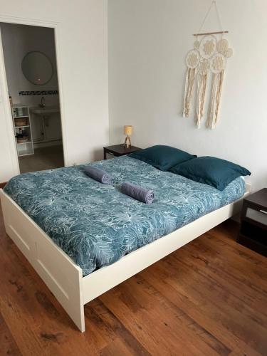 En eller flere senge i et værelse på Appartement Saint-Malo - Arrivée autonome