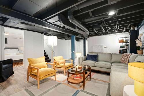 a living room with a couch and a table and chairs at Robbin's Nest - Linden Hills - Walk to Creek Trail in Minneapolis