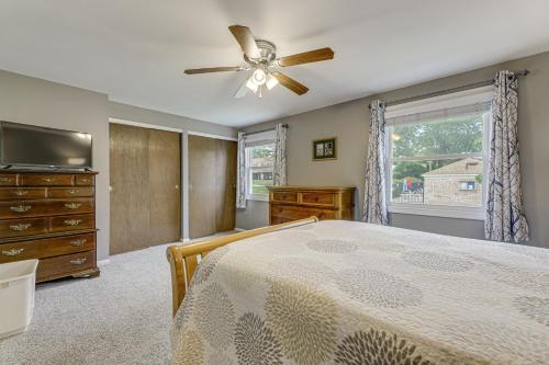 a bedroom with a bed and a ceiling fan at Townhome 10 Mi to WPAFB and Dayton! in Beavercreek