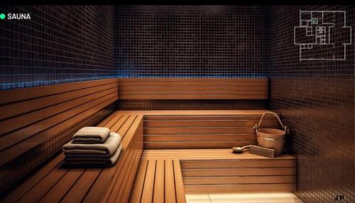 a sauna with two towels and a bucket in it at Edifício Concept in Marília