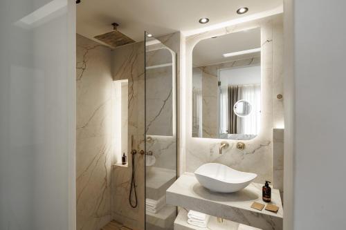 a bathroom with a sink and a shower at GkF Luxury Villas in Naxos Chora