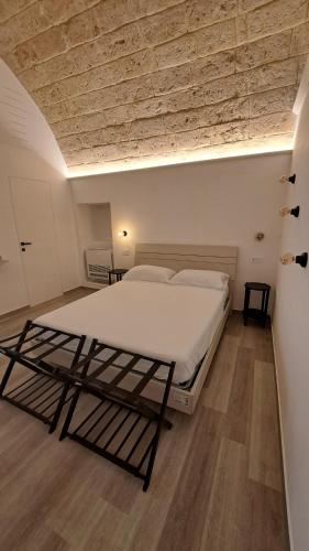 Ένα ή περισσότερα κρεβάτια σε δωμάτιο στο Il porto è di casa