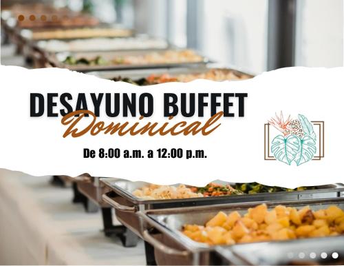 a buffet line with many trays of food at Hotel Plaza Palenque in Palenque