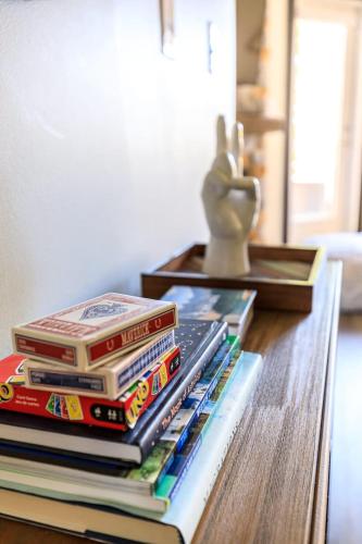 a stack of books sitting on a table at Alpine Oasis at Alpine Village in Canmore
