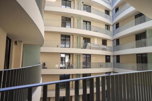an external view of a building with balconies at Giselle Escape in Tirana