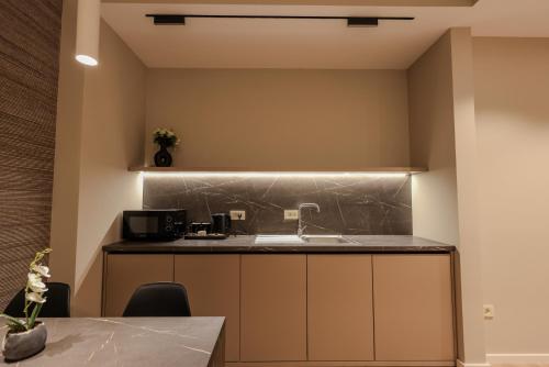 a kitchen with a sink and a counter at Giselle Escape in Tirana
