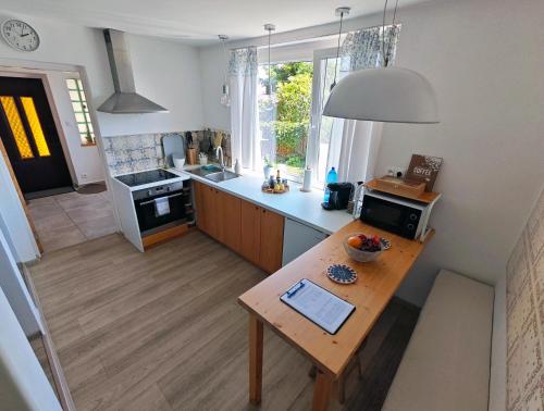 an overhead view of a kitchen with a wooden table at Penzión Tatroom in Poprad