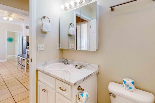 a bathroom with a sink and a toilet at Midsummer Solstice in Dauphin Island