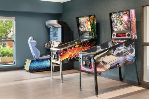 a room with two pinball machines on display at Madison Marriott South in Madison
