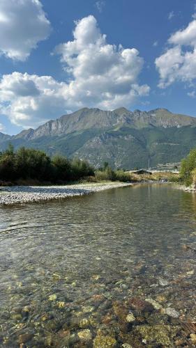 a body of water with mountains in the background at ABBA Ethno House in Gusinje