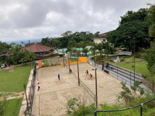 a group of people playing a game in a park at Mata Atlântica Park Hotel in Matinhos