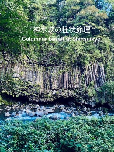 a sign that reads columbinian benefit at simstimbestosbestosbestos at まるしっぽ邸-Marushippotei-連泊20パーセントOFF!Onsen,BBQ,hammock,national park,home theater in Murautsuri