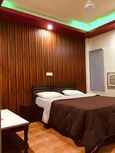 Ένα ή περισσότερα κρεβάτια σε δωμάτιο στο Hotel Shri Ranga Top