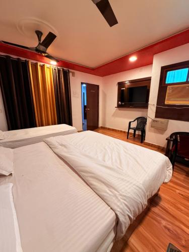 Ένα ή περισσότερα κρεβάτια σε δωμάτιο στο Hotel Shri Ranga Top
