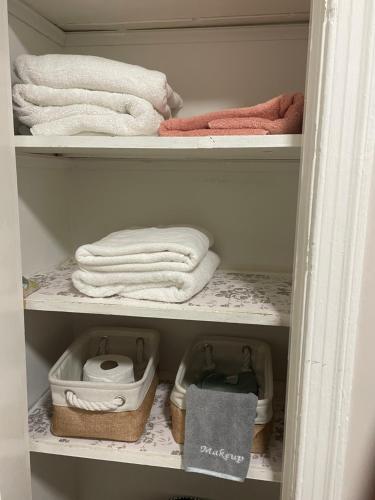 a towel rack with towels and towels in a closet at Home Away from Home Stay - 2 Bedroom,1 Bathroom - Near Capitol Hill in Washington