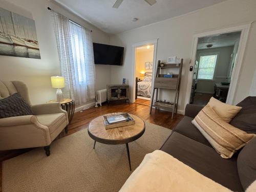 a living room with a couch and a table at 05mile to Boston Childrens, Brigham, Dana F, BI in Longwood Station