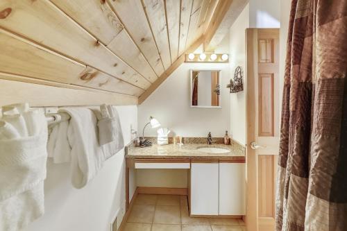 a bathroom with a sink and a mirror at Beautiful Peak 7 Private Home in Breckenridge