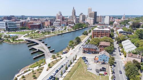 an aerial view of a city with a river and a bridge at The Hill in Providence