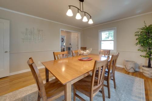 a dining room with a wooden table and chairs at Walk to Frontier Days Park Cheyenne Home with Patio in Cheyenne